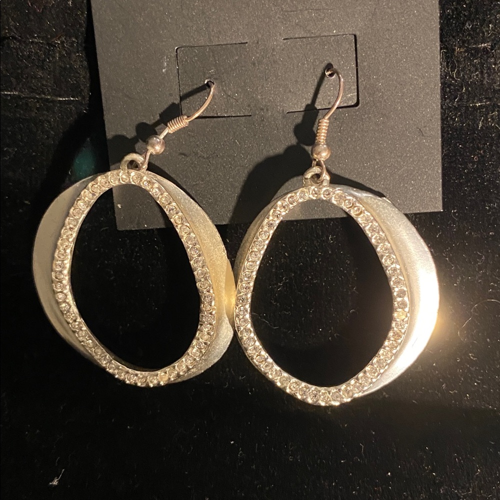 Karine Sultan Silver and cz oval hoop earrings. One and one half inches.